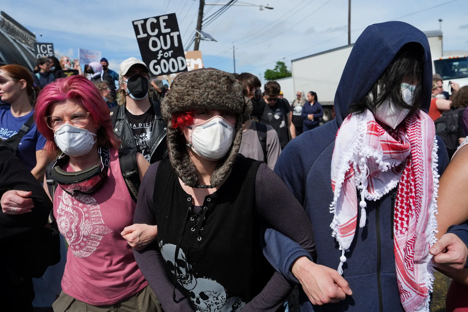 Protesters demonstrate in front of ICE officers outside Delaney Hall in Newark, New Jersey, U.S., May 25, 2026. REUTERS/Ryan Murphy