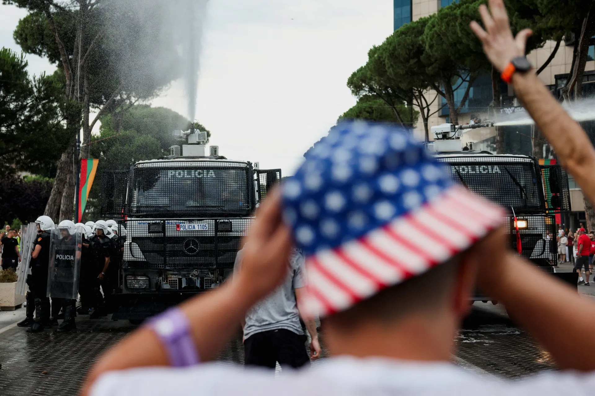 Police use a water cannon during a protest against a luxury resort, a plan by a company linked to Donald Trump's son-in-law, Jared Kushner, on an environmentally sensitive part of the Adriatic coast, in Tirana, Albania, June 3, 2026. REUTERS/Florion Goga