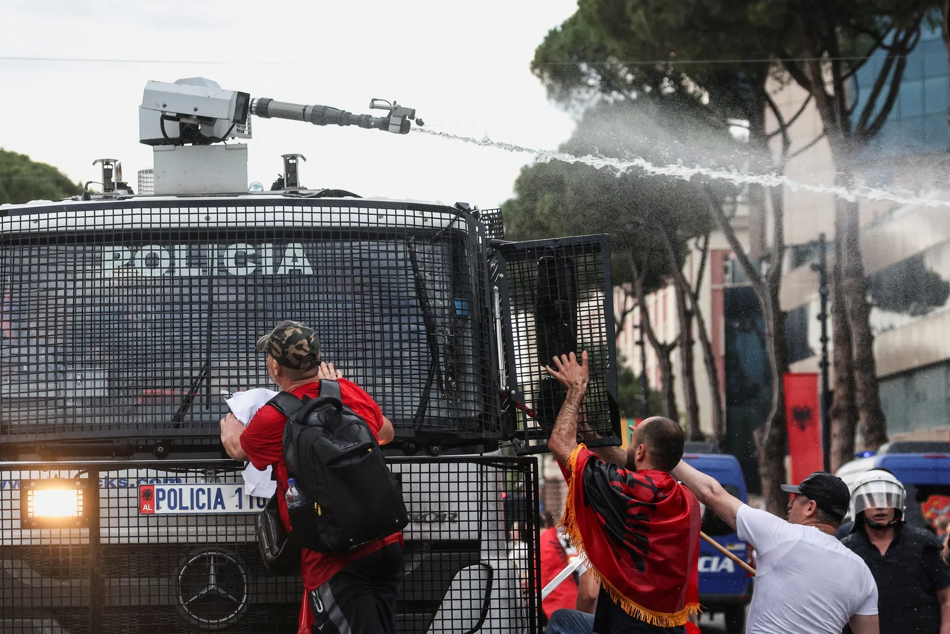 Police use a water cannon during a protest against a luxury resort, a plan by a company linked to Donald Trump's son-in-law, Jared Kushner, on an environmentally sensitive part of the Adriatic coast, in Tirana, Albania, June 3, 2026. REUTERS/Florion Goga