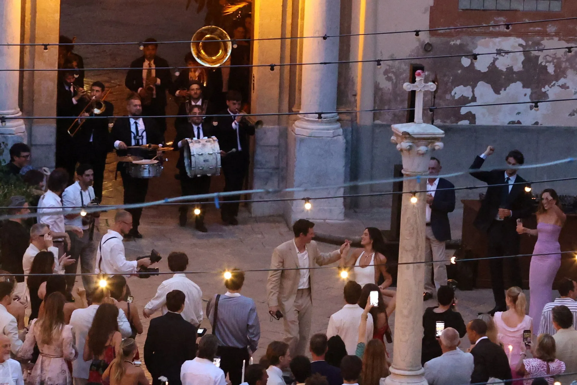 Singer Dua Lipa dances with her husband, actor Callum Turner, during wedding festivities following their marriage, in Palermo, Italy, June 5, 2026. REUTERS/Igor Petyx