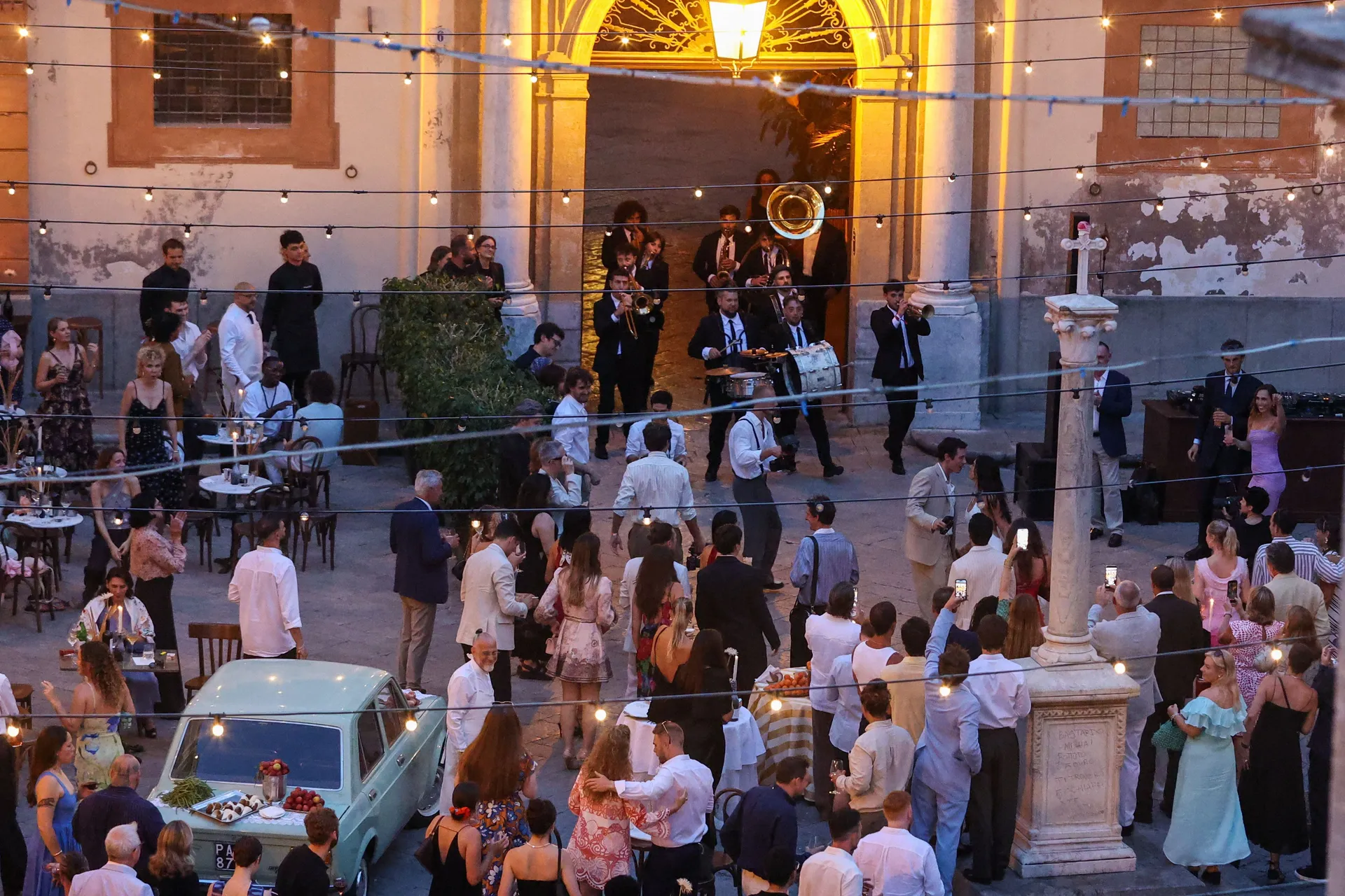 Singer Dua Lipa speaks with her husband, actor Callum Turner, during wedding festivities following their marriage, in Palermo, Italy, June 5, 2026. REUTERS/Igor Petyx
