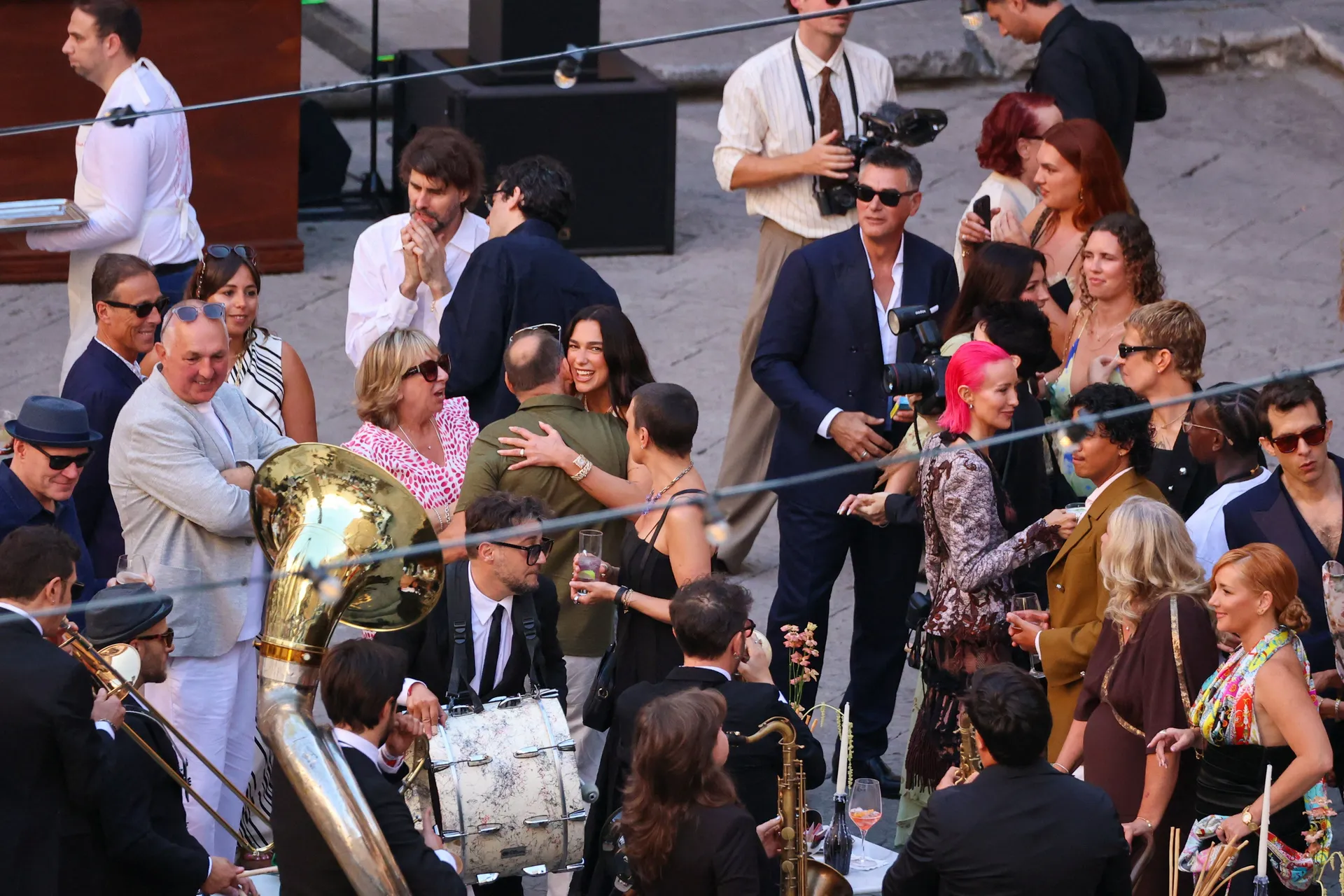 Singer Dua Lipa hugs a guest during wedding festivities following her marriage to actor Callum Turner, in Palermo, Italy, June 5, 2026. REUTERS/Igor Petyx