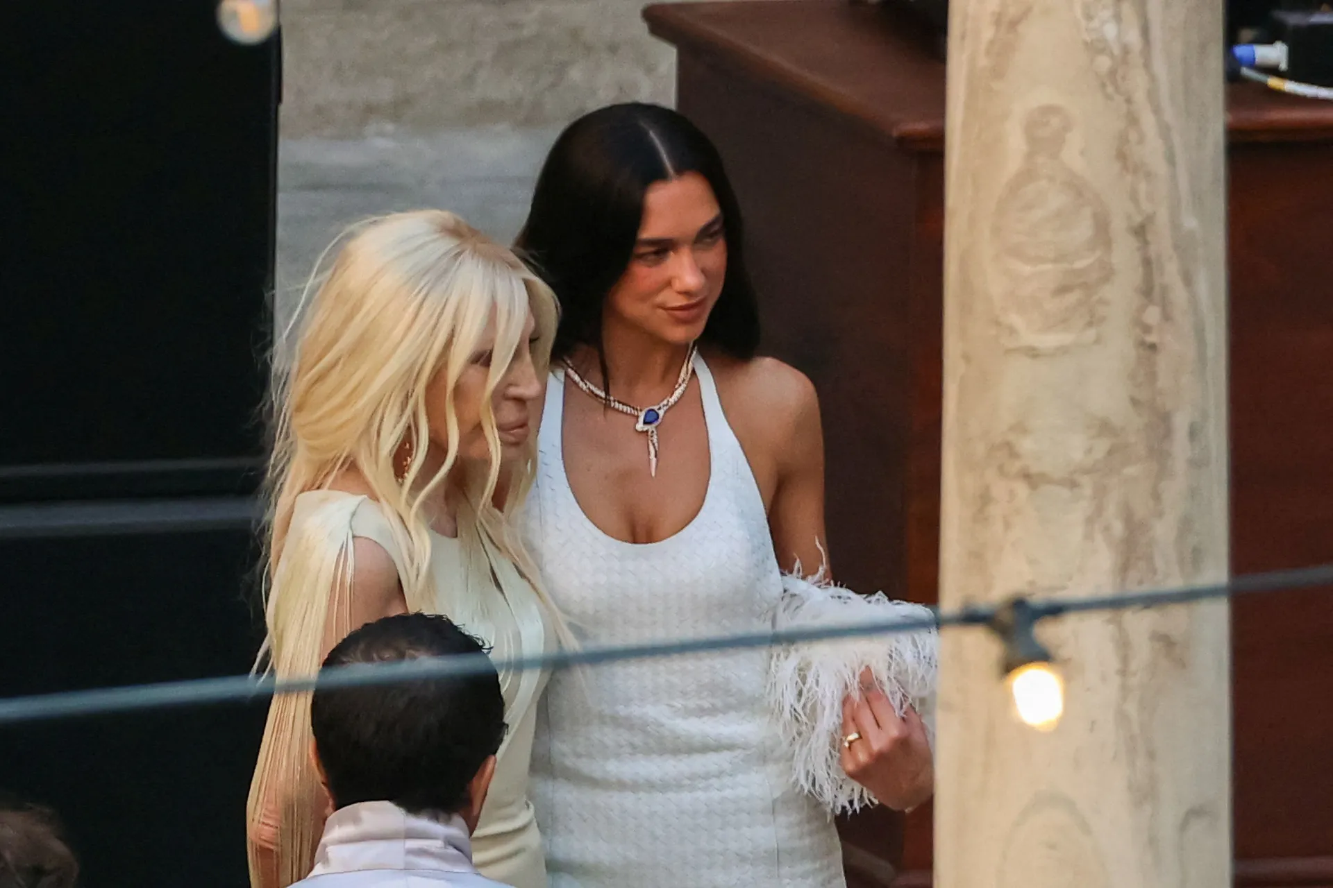 Singer Dua Lipa stands with designer Donatella Versace during wedding festivities following Lipa’s marriage to actor Callum Turner, in Palermo, Italy, June 5, 2026. REUTERS/Igor Petyx