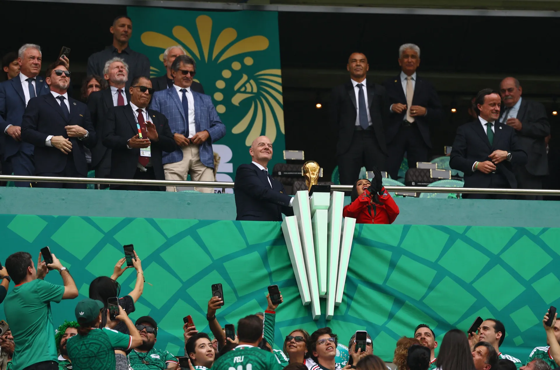 Soccer Football - FIFA World Cup 2026 - Group A - Mexico v South Africa - Estadio Azteca, Mexico City, Mexico - June 11, 2026 FIFA President Gianni Infantino holds the FIFA World Cup trophy alongside actress and FIFA World Cup 2026 Ambassador Salma Hayek 