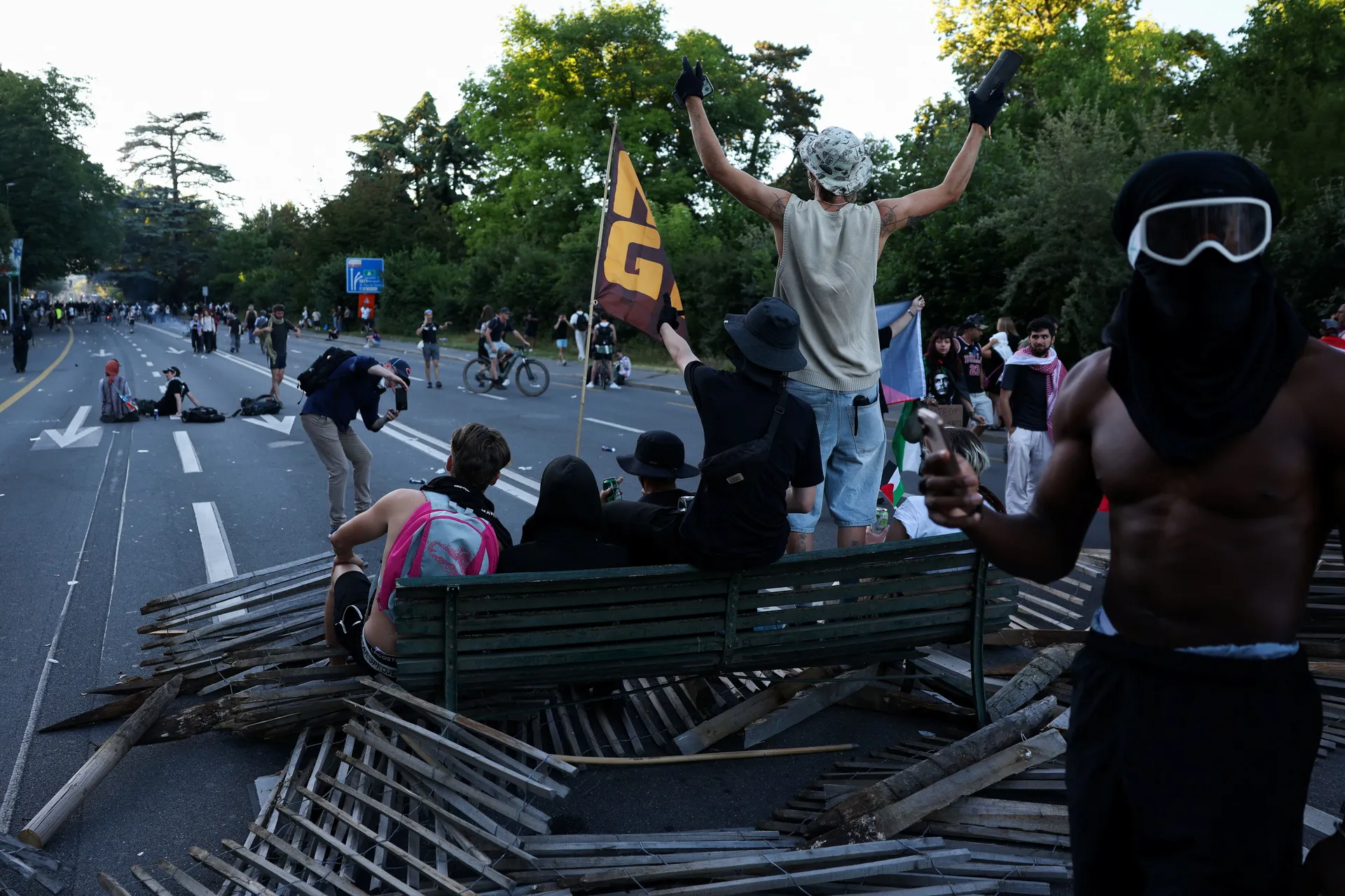 People take part in a protest against the upcoming G7 summit in Evian-les-Bains in France, in Geneva, Switzerland, June 14, 2026. REUTERS/Umit Bektas