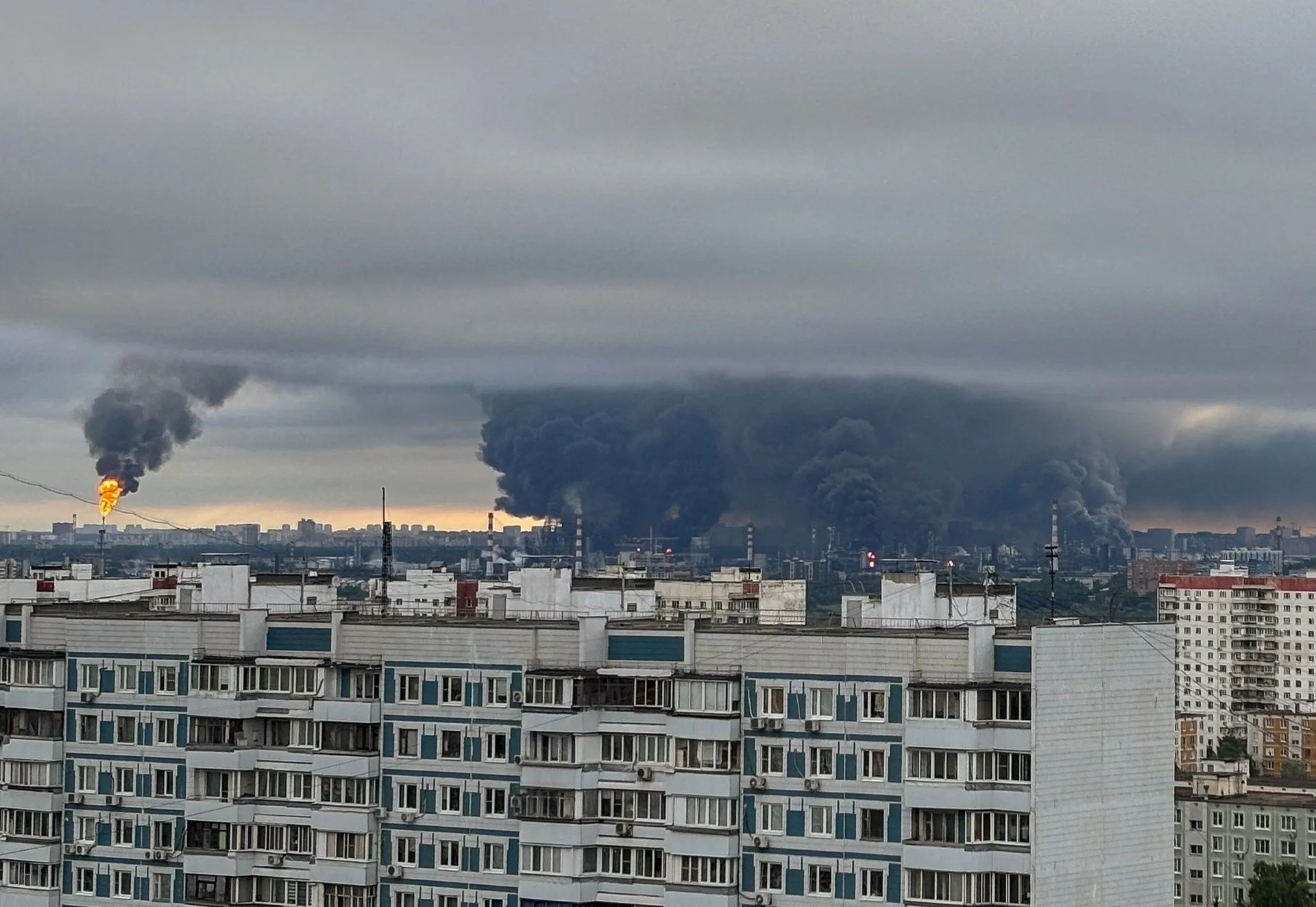 Thick plumes of smoke with flames rise from an oil refinery following what the authorities say is a Ukrainian drone strike in the course of Russia-Ukraine conflict, in Moscow, Russia, June 18, 2026, in this picture obtained from social media. SOCIAL MEDIA