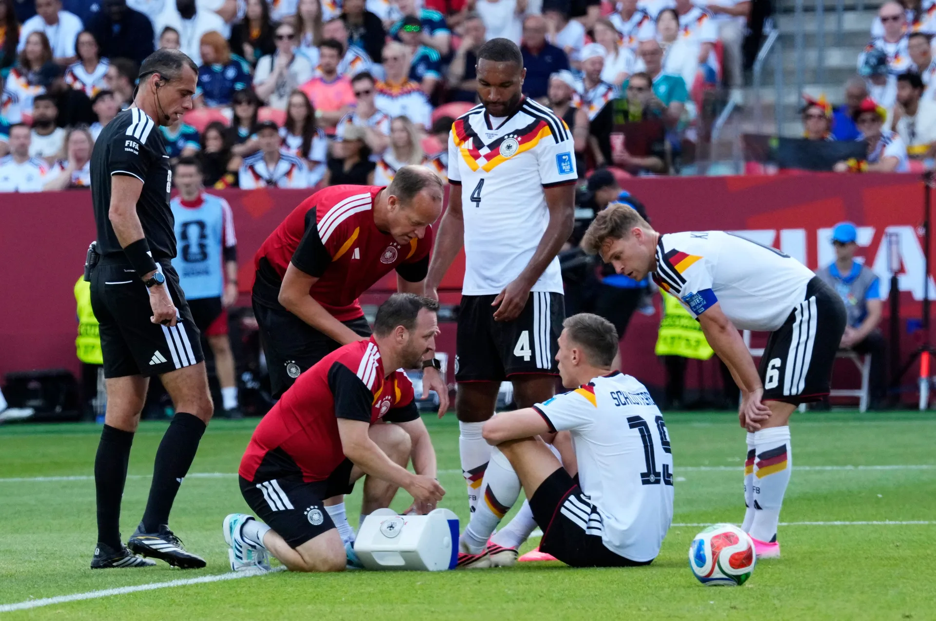 Soccer Football - FIFA World Cup 2026 - Group E - Germany v Ivory Coast - Toronto Stadium, Toronto, Canada - June 20, 2026 Germany's Nico Schlotterbeck receives medical attention after sustaining an injury IMAGN IMAGES via Reuters/Kevin Sousa