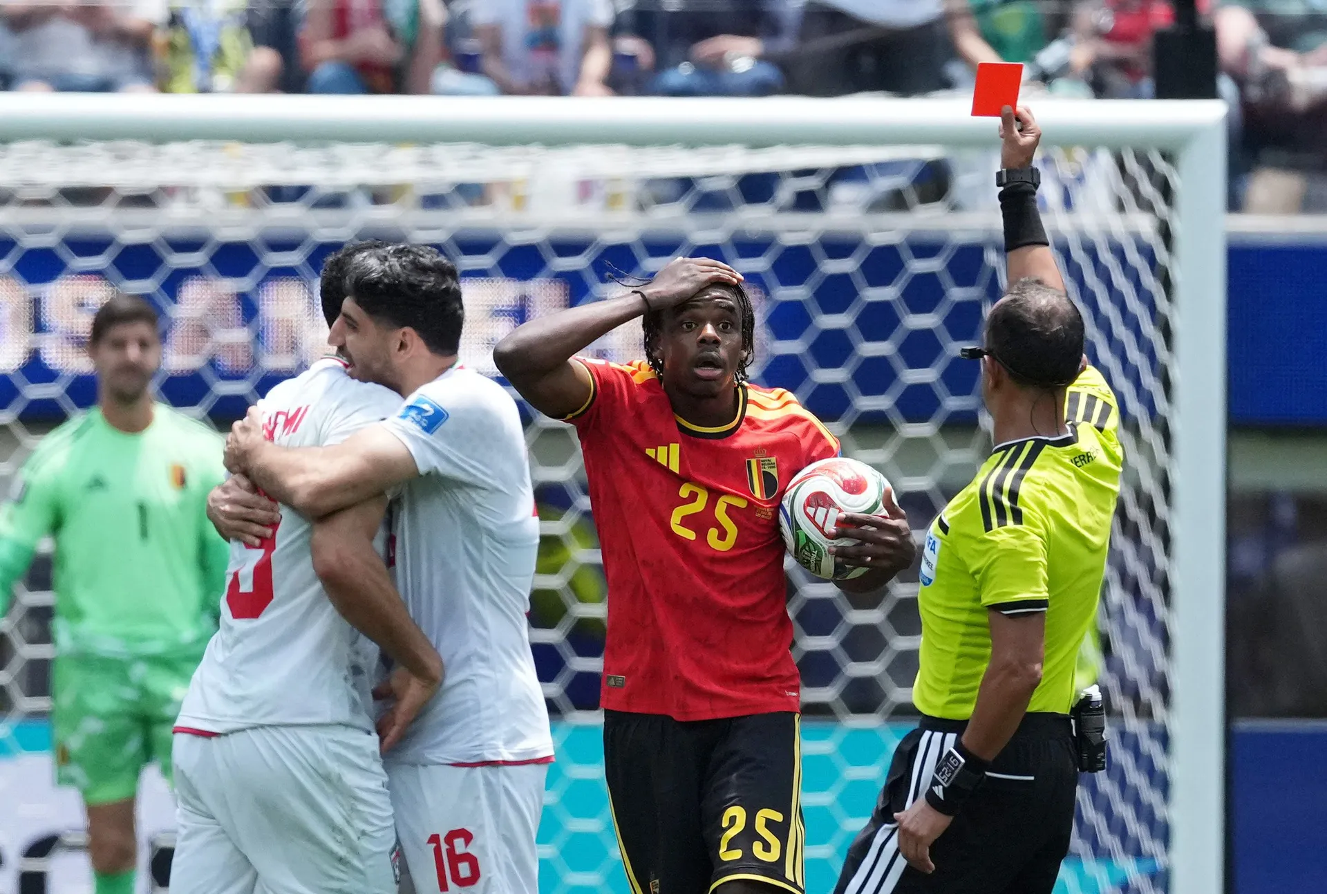 Soccer Football - FIFA World Cup 2026 - Group G - Belgium v Iran - Los Angeles Stadium, Inglewood, California, U.S. - June 21, 2026 Belgium's Nathan Ngoy is shown a red card by referee Dario Herrera IMAGN IMAGES via Reuters/Kirby Lee