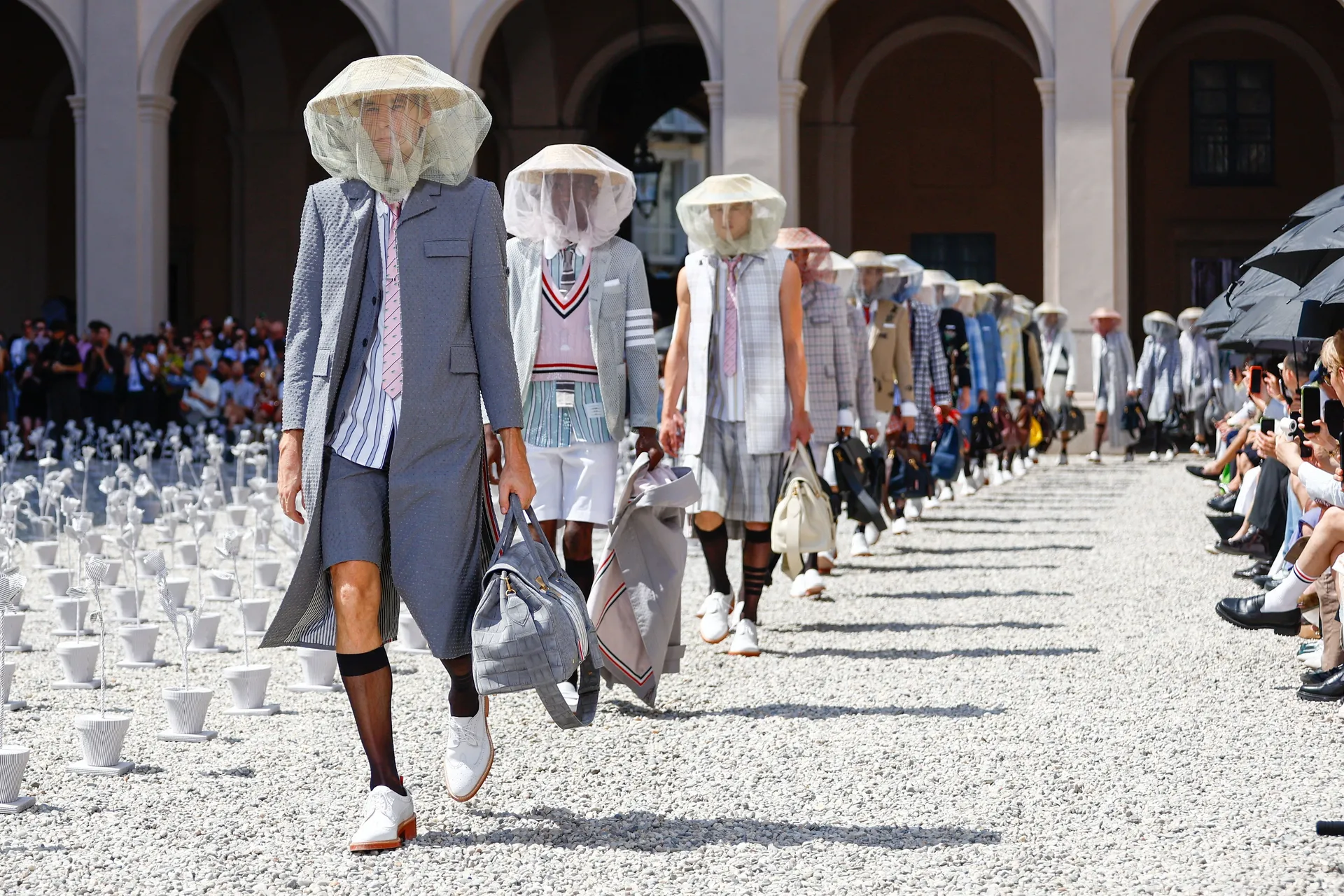 Models present a creation from Thom Browne’s Spring/Summer 2027 men’s collection show as part of Milan Fashion Week, in Milan, Italy, June 22, 2026. REUTERS/Alessandro Garofalo