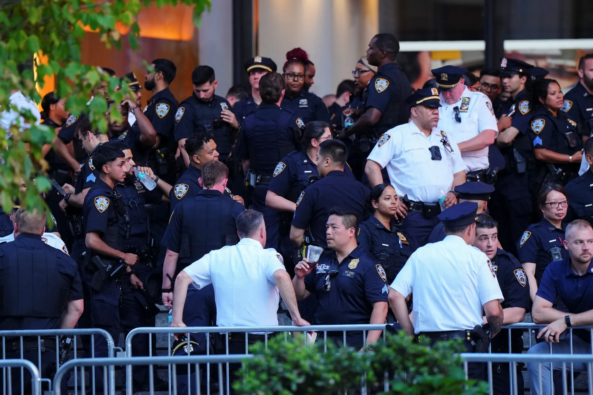 New York City Police Department officers stand outside Madison Square Garden, the venue for the wedding celebrations of singer Taylor Swift and National Football League (NFL) player Travis Kelce, in New York, U.S., July 3, 2026.  REUTERS/Angelina Katsanis