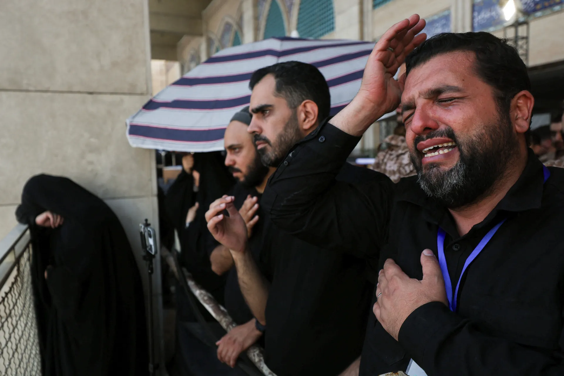 People react at a public farewell ceremony to pay their respects to late Supreme Leader Ayatollah Ali Khamenei, who was killed on February 28 in Israeli and U.S. airstrikes, at the Imam Khomeini Grand Mosalla, in Tehran, Iran July 4, 2026.  REUTERS/Mohamm