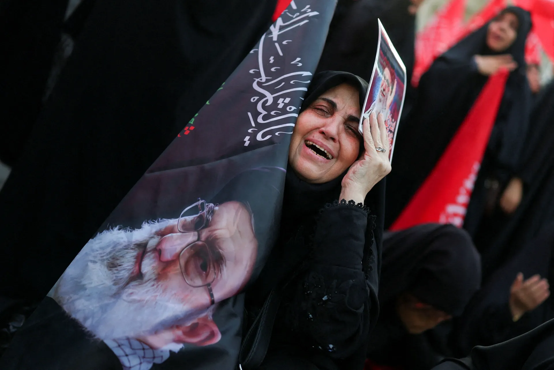 A woman reacts on the day of a public farewell ceremony to pay respect to late Supreme Leader Ayatollah Ali Khamenei, who was killed on February 28 in Israeli and U.S. airstrikes, at the Imam Khomeini Grand Mosalla, in Tehran, Iran July 4, 2026.  REUTERS/