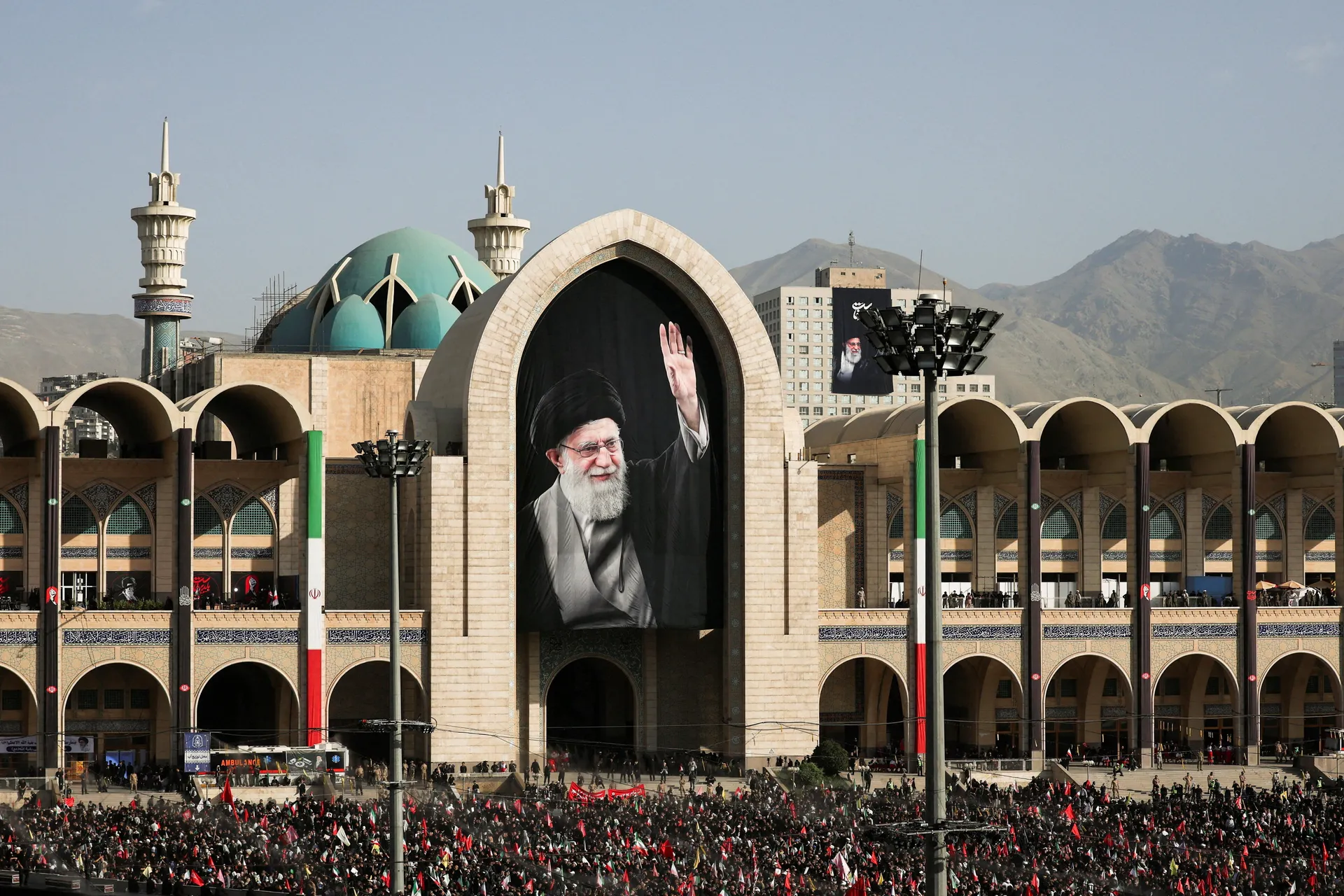 A banner with an image of late Supreme Leader Ayatollah Ali Khamenei is displayed as people gather on the day of a public farewell ceremony to pay their respects to Khamenei, who was killed on February 28 in Israeli and U.S. airstrikes, at the Imam Khomei