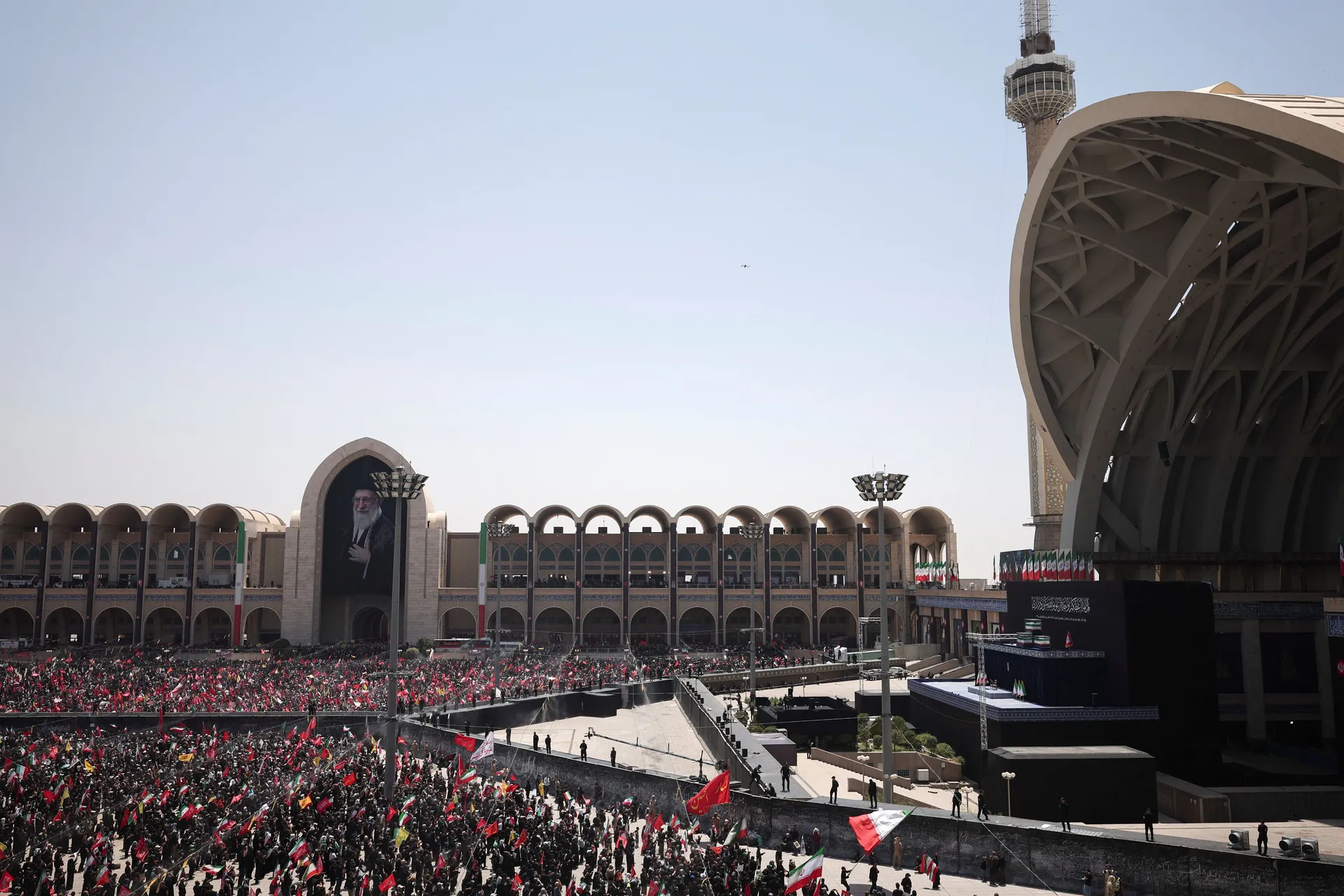 Mourners wave flags as they attend a public farewell ceremony to pay their respects to late Supreme Leader Ayatollah Ali Khamenei, who was killed on February 28 in Israeli and U.S. airstrikes, at the Imam Khomeini Grand Mosalla, in Tehran, Iran July 5, 20