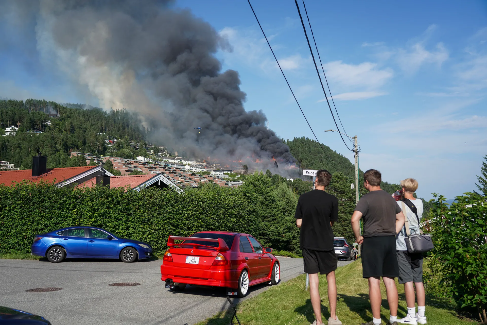 Smoke rises from a large fire that has spread from terraced houses in Krokstadelva, Drammen municipality, Norway, July 17, 2026. More than 50 homes were destroyed by fire on Friday near the city of Drammen in southern Norway as firefighters battled to con