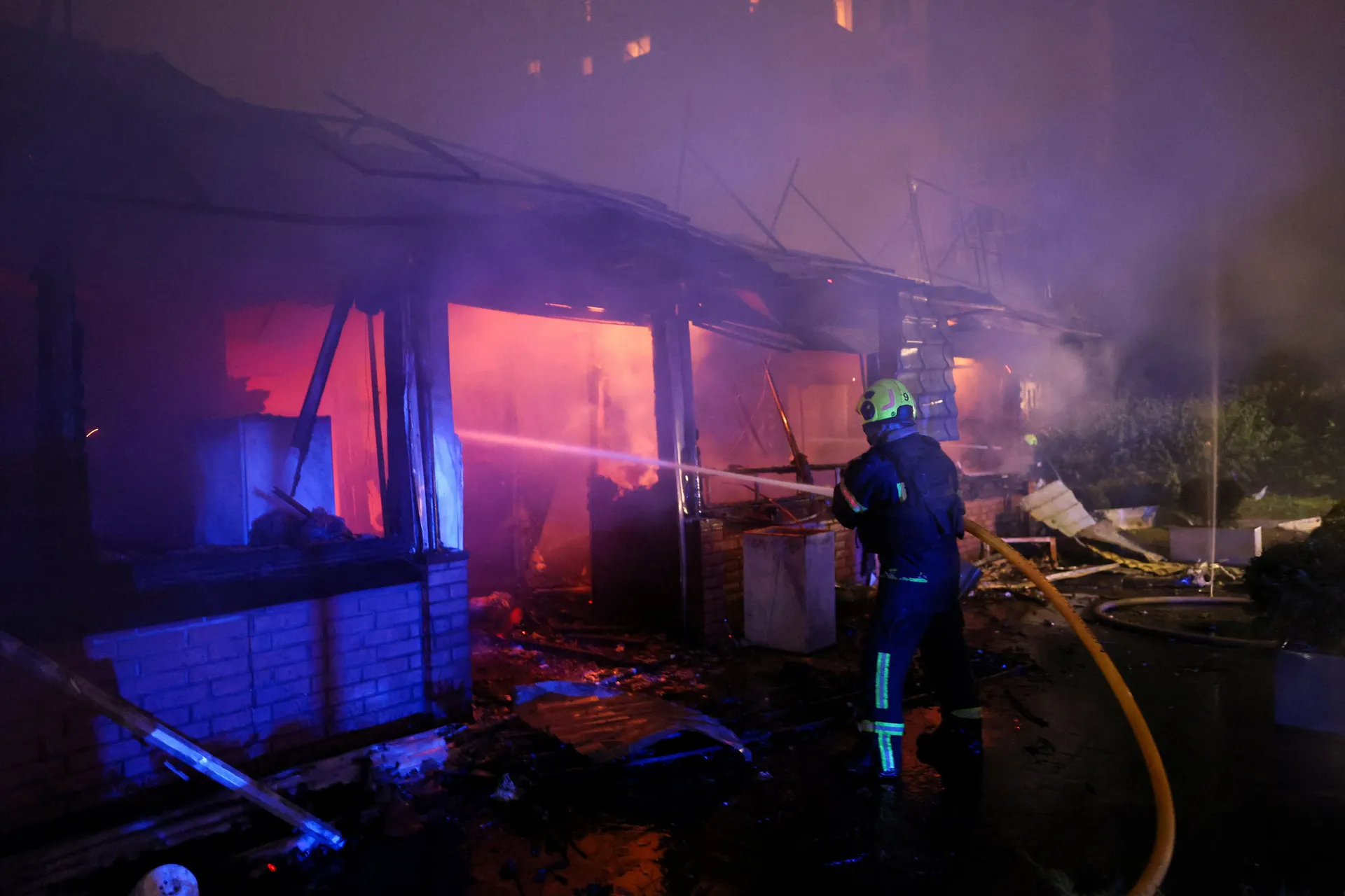 A Firefighter works at the site of an apartment building damaged during Russian missile strikes, amid Russia’s attack on Ukraine, in Kyiv, Ukraine July 19, 2026. REUTERS/Gleb Garanich