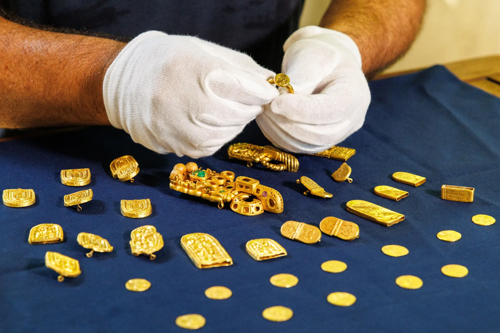 Igor Miholjek, head of research, Croatian Conservation Institute, Department of Underwater Archaeology, shows the gold found in a Byzantium shipwreck near Polace on the island of Mljet, Croatia, July 21, 2026. REUTERS/Antonio Bronic