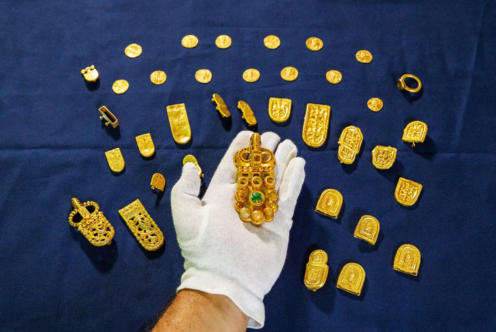 Igor Miholjek, head of research, Croatian Conservation Institute, Department of Underwater Archaeology, shows the gold found in a Byzantium shipwreck near Polace on the island of Mljet, Croatia, July 21, 2026. REUTERS/Antonio Bronic TPX IMAGES OF THE