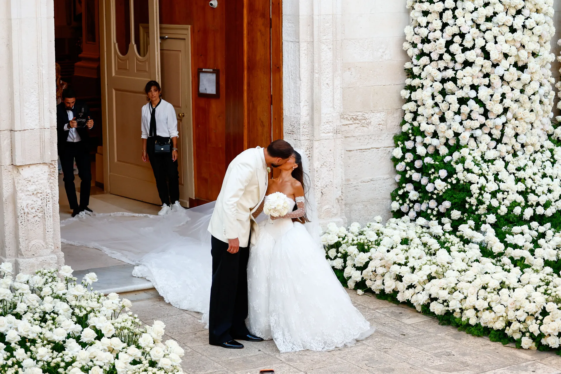 Manchester City goalkeeper and Italy captain Gianluigi Donnarumma kisses his wife Alessia Elefante following their wedding ceremony at the Chiesa Madre di San Giorgio Martire in Locorotondo, Italy, July 24, 2026. REUTERS/Alessandro Garofalo