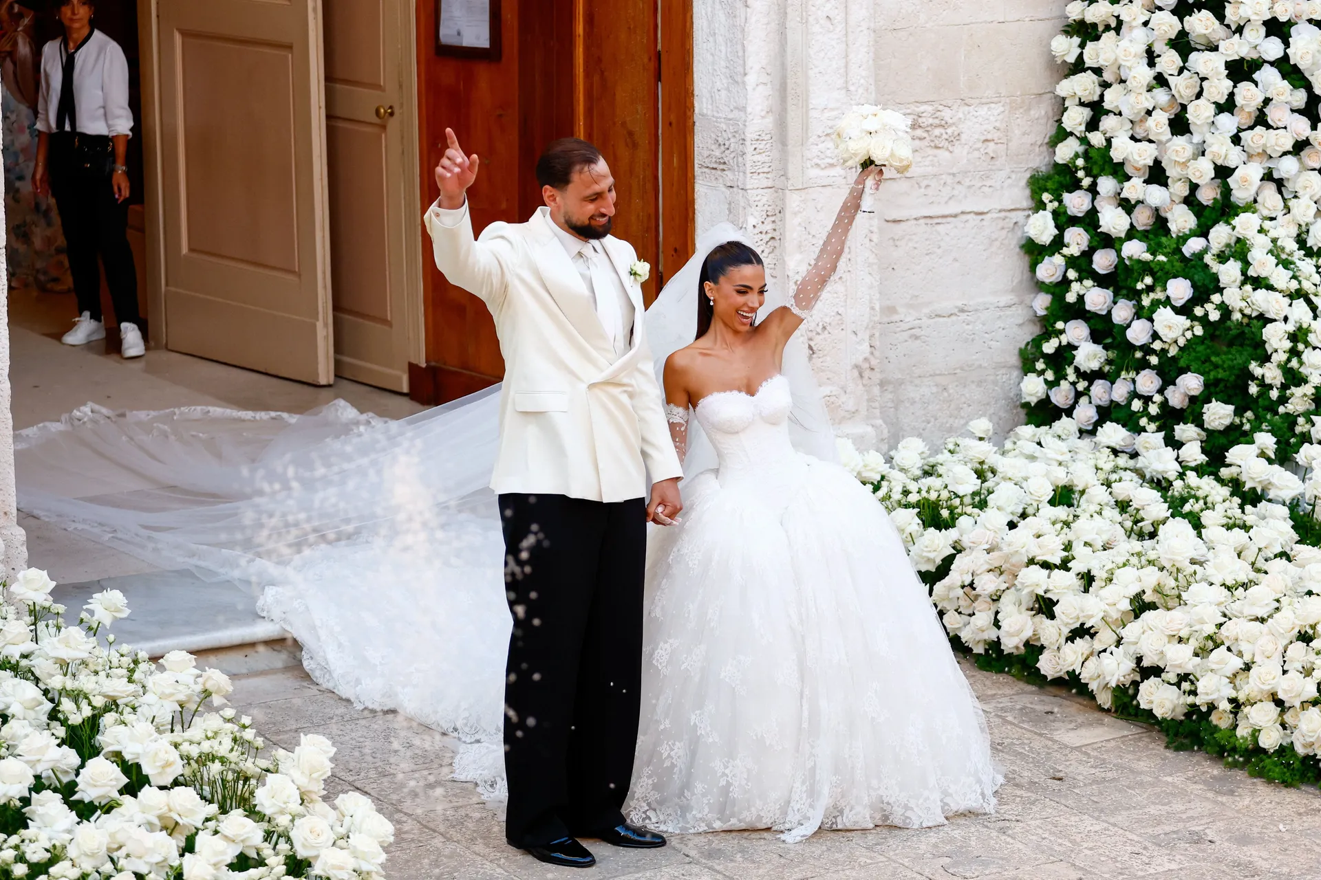 Manchester City goalkeeper and Italy captain Gianluigi Donnarumma and his wife Alessia Elefante celebrate following their wedding ceremony at the Chiesa Madre di San Giorgio Martire in Locorotondo, Italy, July 24, 2026. REUTERS/Alessandro Garofalo     TPX