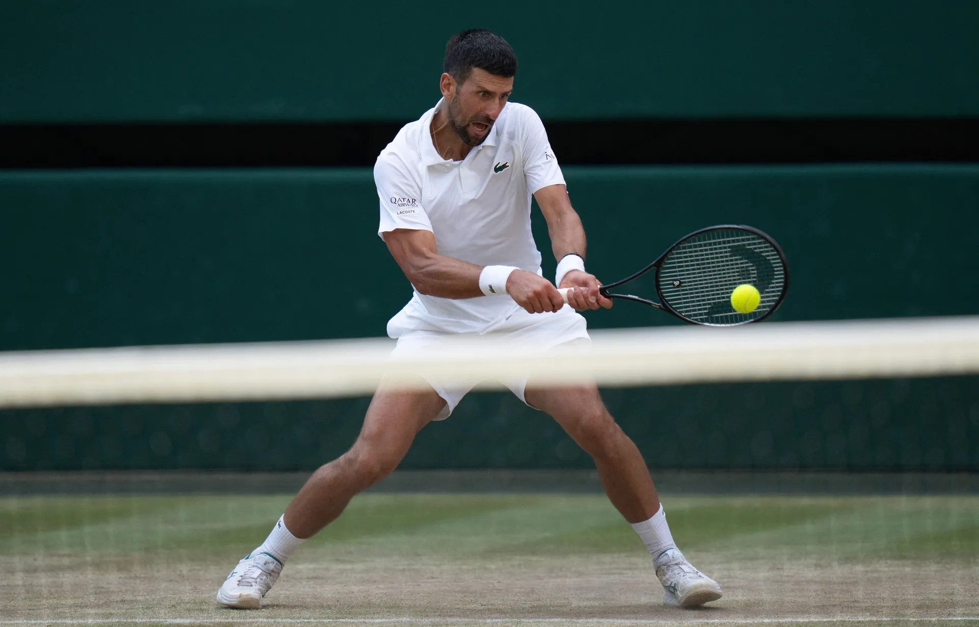 FILE PHOTO: Jul 10, 2026; London, United Kingdom; Novak Djokovic of Serbia returns a shot during his semifinal match against Jannik Sinner of Italy on day 12 at All England Lawn Tennis and Croquet Club.  Mandatory Credit: Susan Mullane-Imagn Images/File P