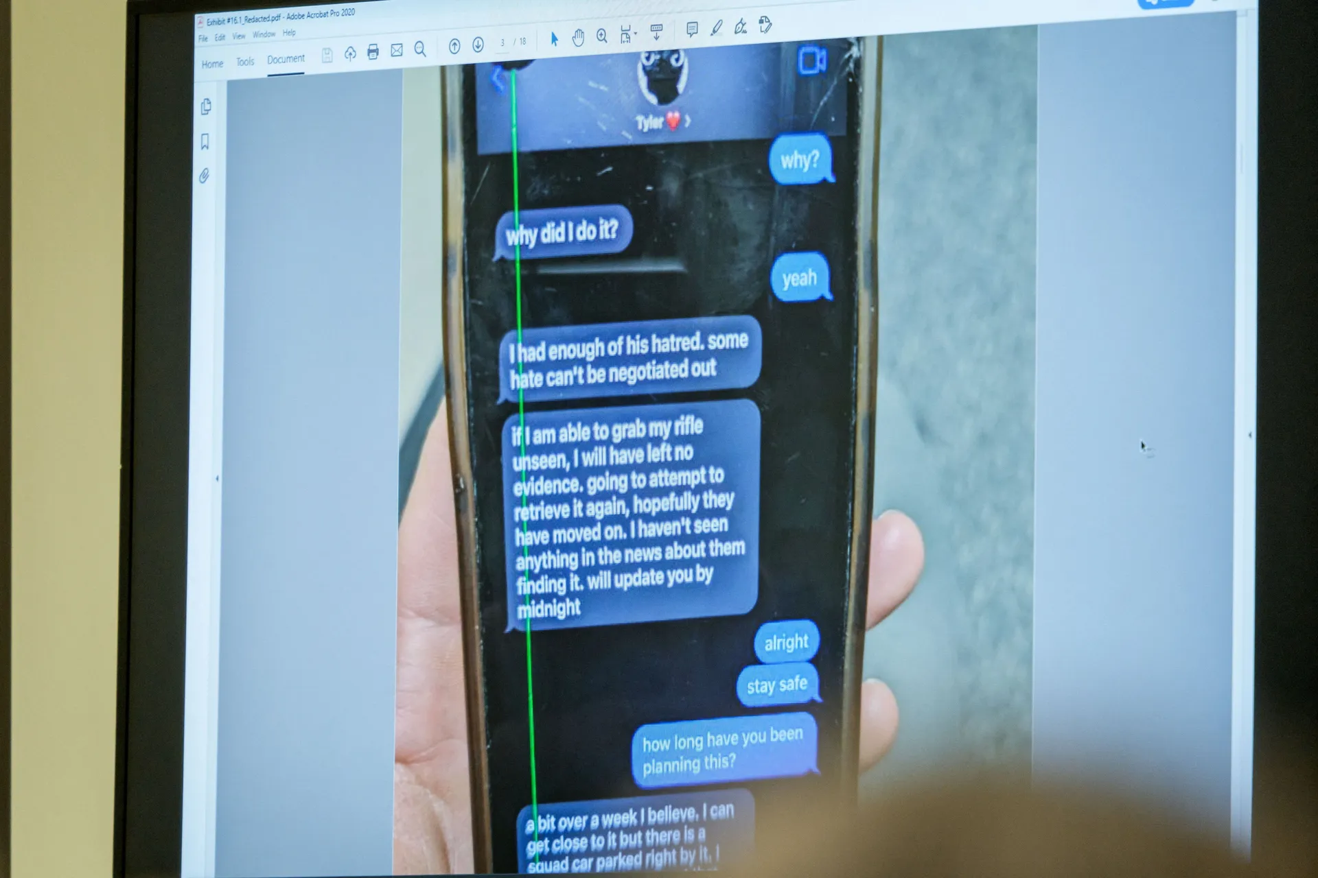 A photograph which prosecutors say shows a text message exchange between Tyler Robinson, who is accused in the fatal shooting of Charlie Kirk, and Lance Twiggs, is shown during a preliminary hearing at the 4th District Court in Provo, Utah, U.S., July 9,