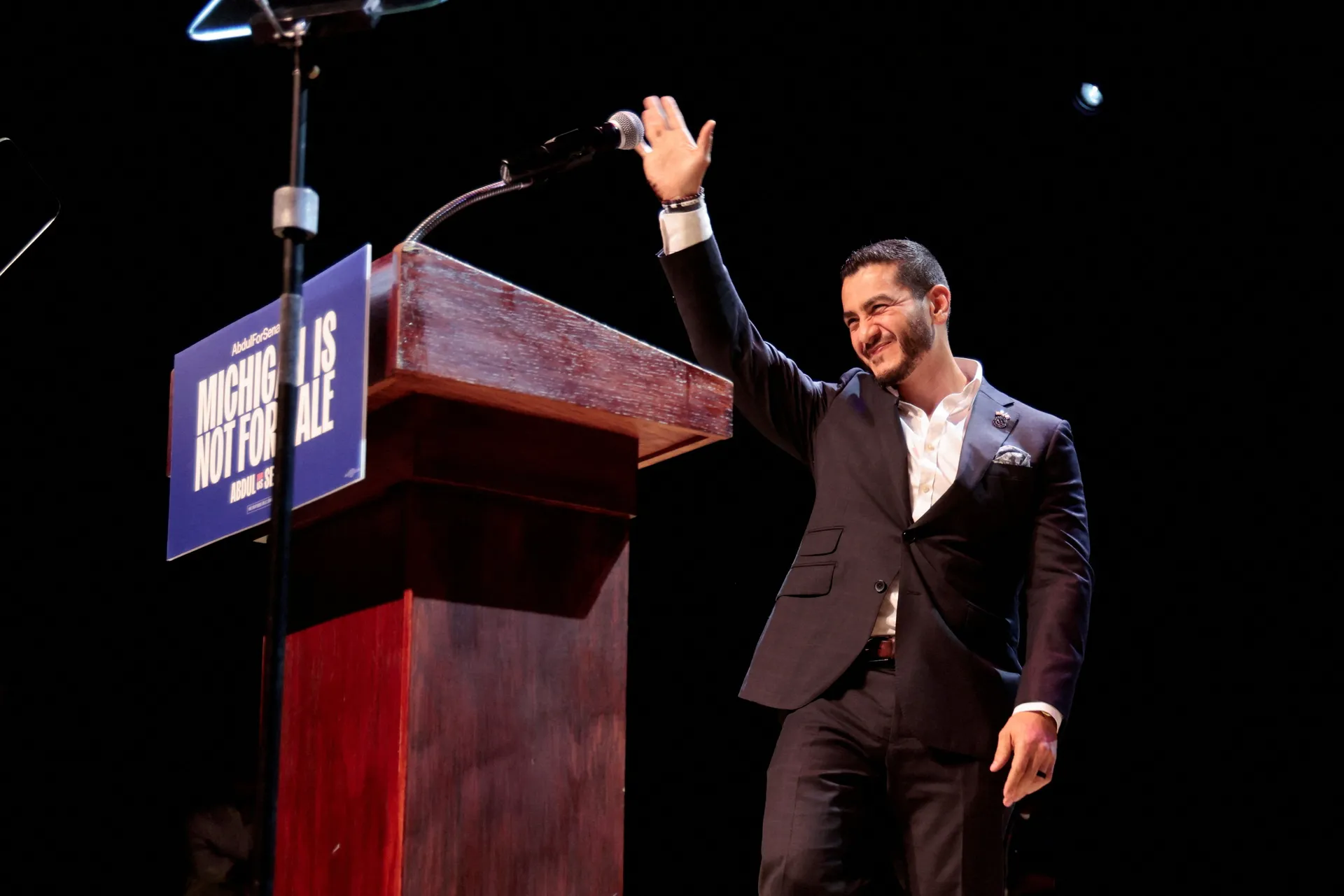 U.S. Senate Democratic candidate Abdul El-Sayed waves on stage, with vote counting continuing for Michigan's Democratic U.S. Senate primary, during an election night rally in Detroit, Michigan, U.S., August 5, 2026. REUTERS/Rebecca Cook REFILE - CORRECTIN