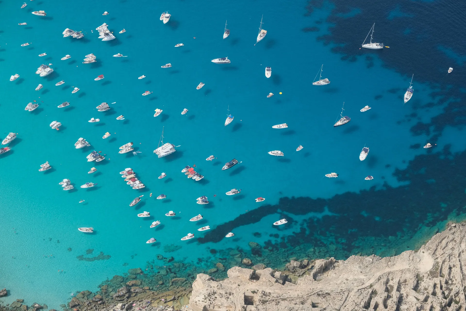 Boats gather in the waters off Favignana, Italy, September 17, 2023. Favignana was used as a filming location for Christopher Nolan’s "The Odyssey", released in Italy on July 16, 2026. REUTERS/Igor Petyx     TPX IMAGES OF THE DAY