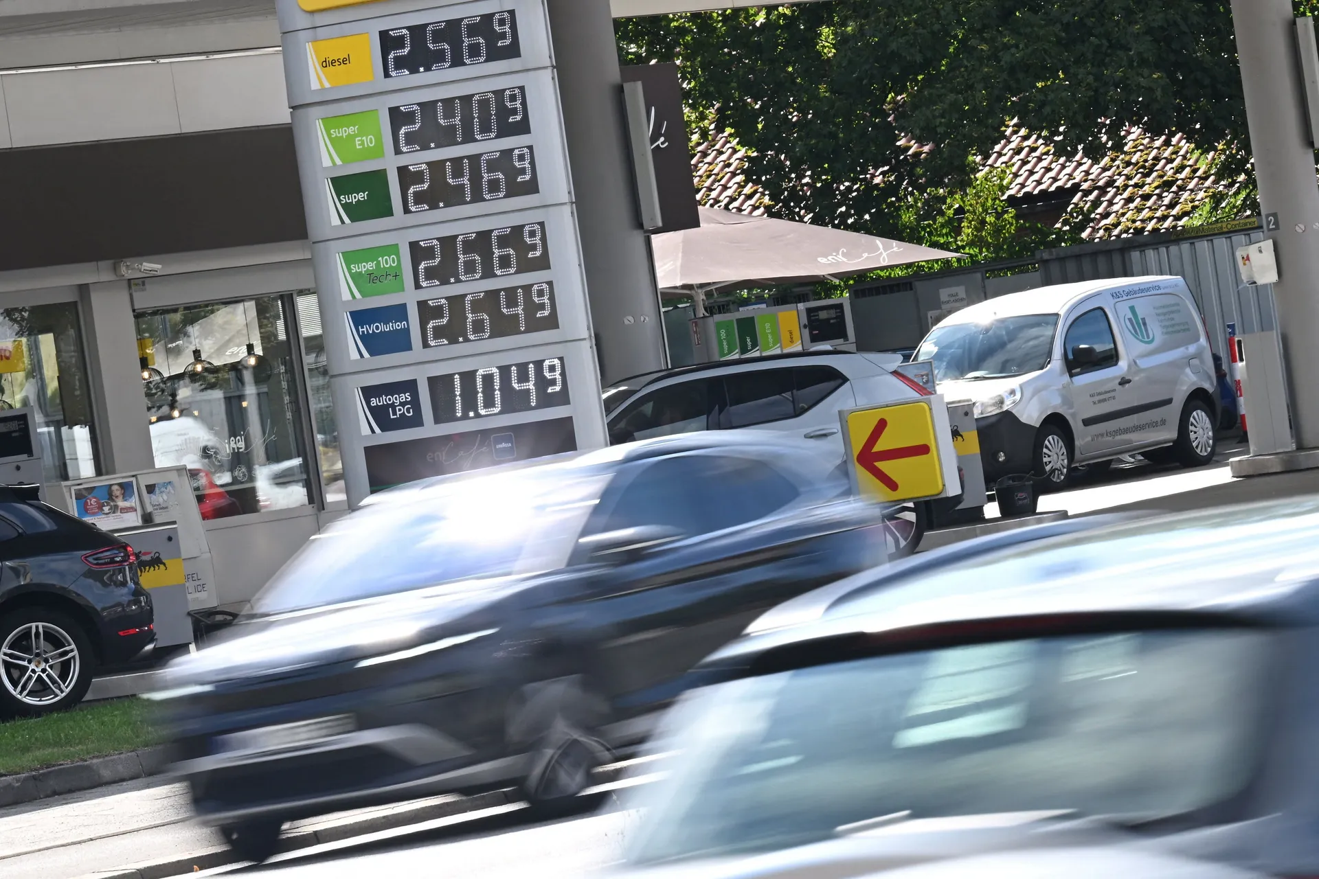 Cars drive past a display board showing the current prices of petrol and diesel at a gas station, in Munich, Germany, September 14, 2026. REUTERS/Angelika Warmuth