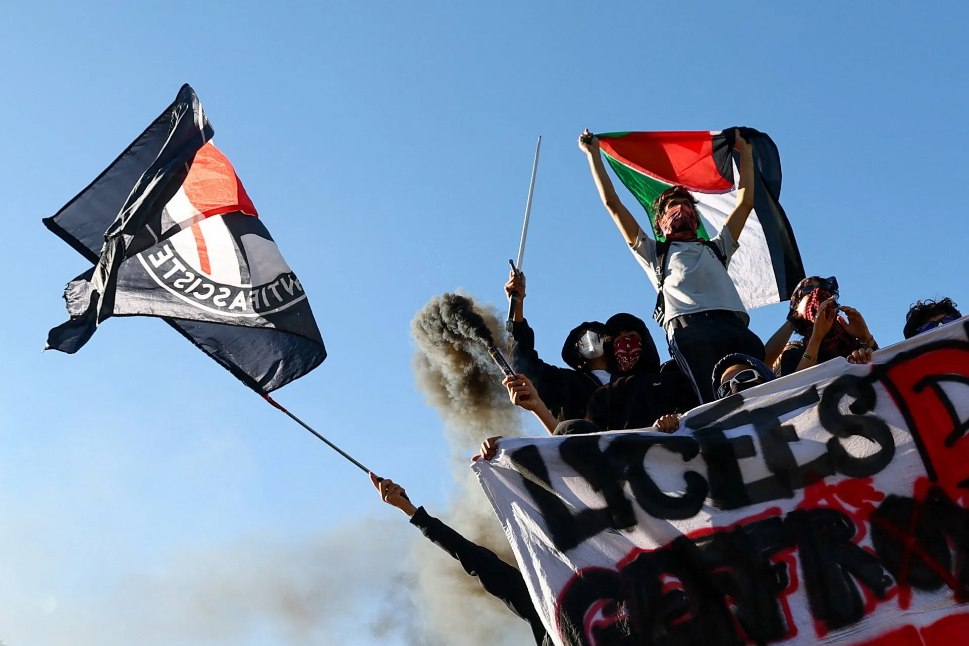 A protester holds a Palestinian flag as French high school and university students attend a demonstration in Strasbourg as part of a nationwide day of protests and blockades, voicing anger over overcrowded classrooms, teacher shortages and dilapidated sch