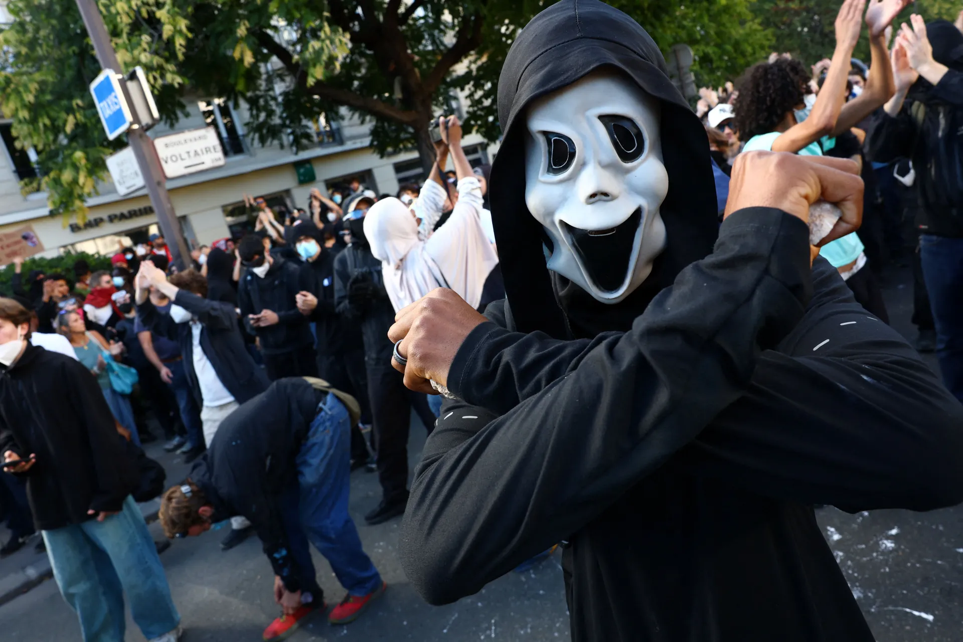 A protester wearing a ghostface mask attends a demonstration by high school and university students, supported by teachers' union and school parents, in Paris as part of a nationwide day of demonstrations and blockades, voicing anger over overcrowded clas