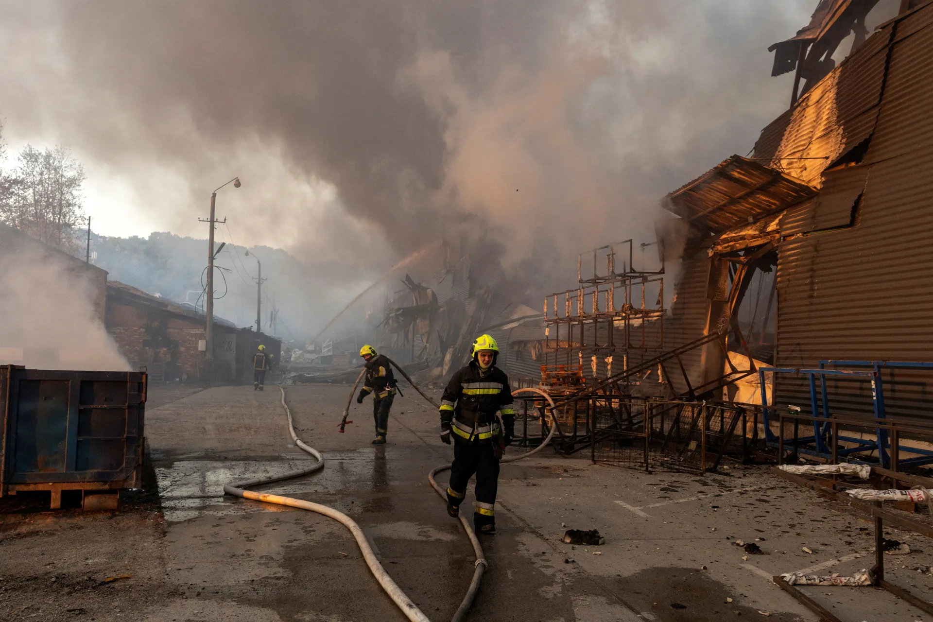 Firefighters work at the site of a warehouse that burned out after it was hit during a night of Russian missile attacks, amid Russia's attack on Ukraine, in Kyiv, Ukraine October 7, 2026. REUTERS/Thomas Peter