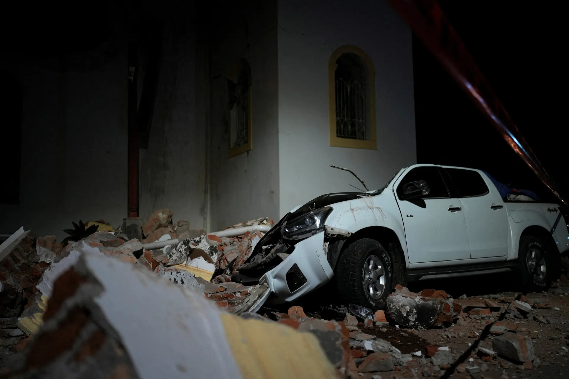 A car damaged by falling debris sits after an earthquake struck near the southern coast of Panama, in Penonome, Panama, October 9, 2026. REUTERS/Enea Lebrun REFILE - UPDATING HEADLINE