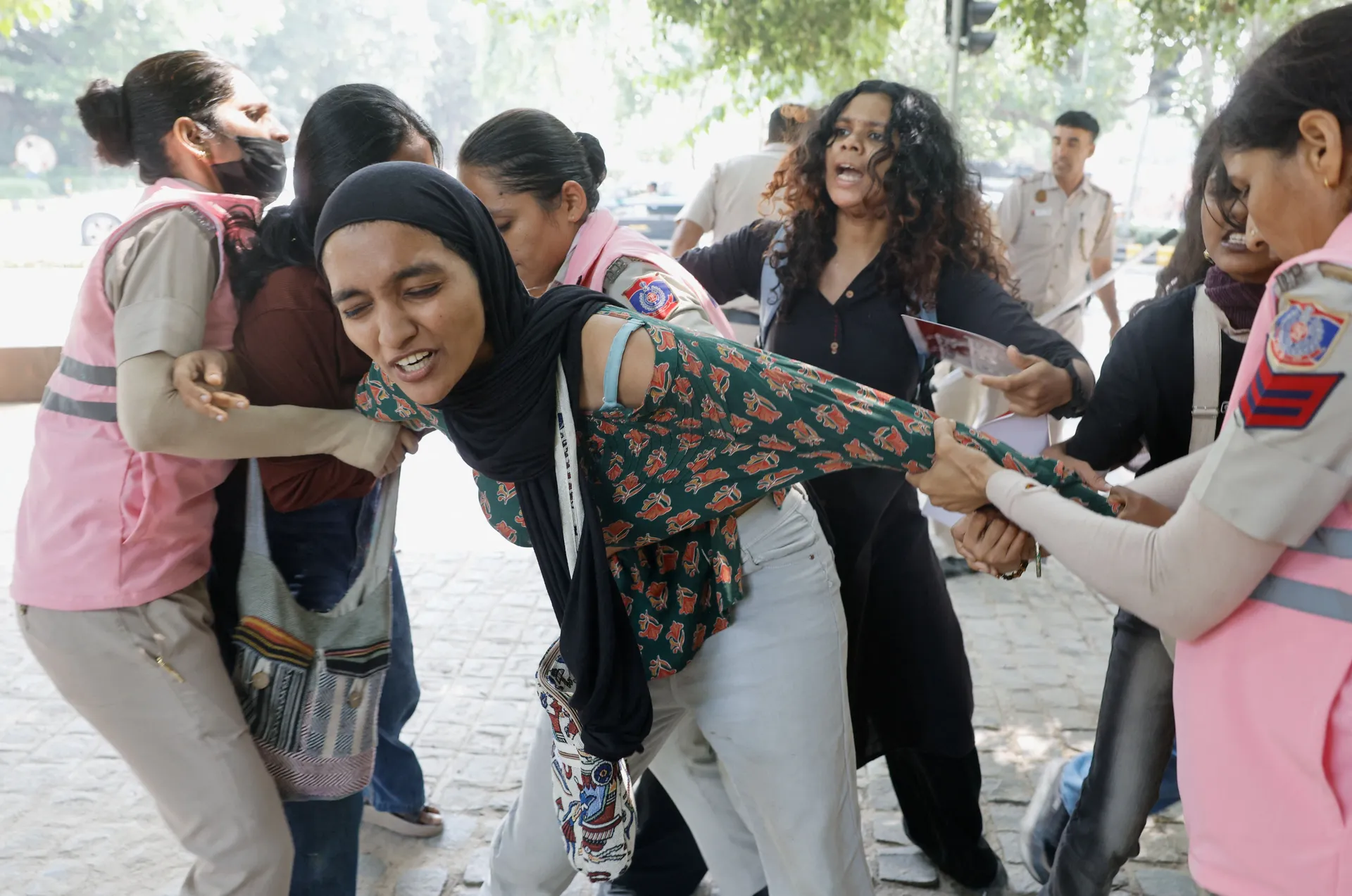 Protesters are detained by security personnel during a protest by the Cockroach Janta Party (CJP) seeking the resignation of India's Chief Election Commissioner Gyanesh Kumar, near the protest site in New Delhi, India, October 10, 2026. REUTERS/Adnan Abid
