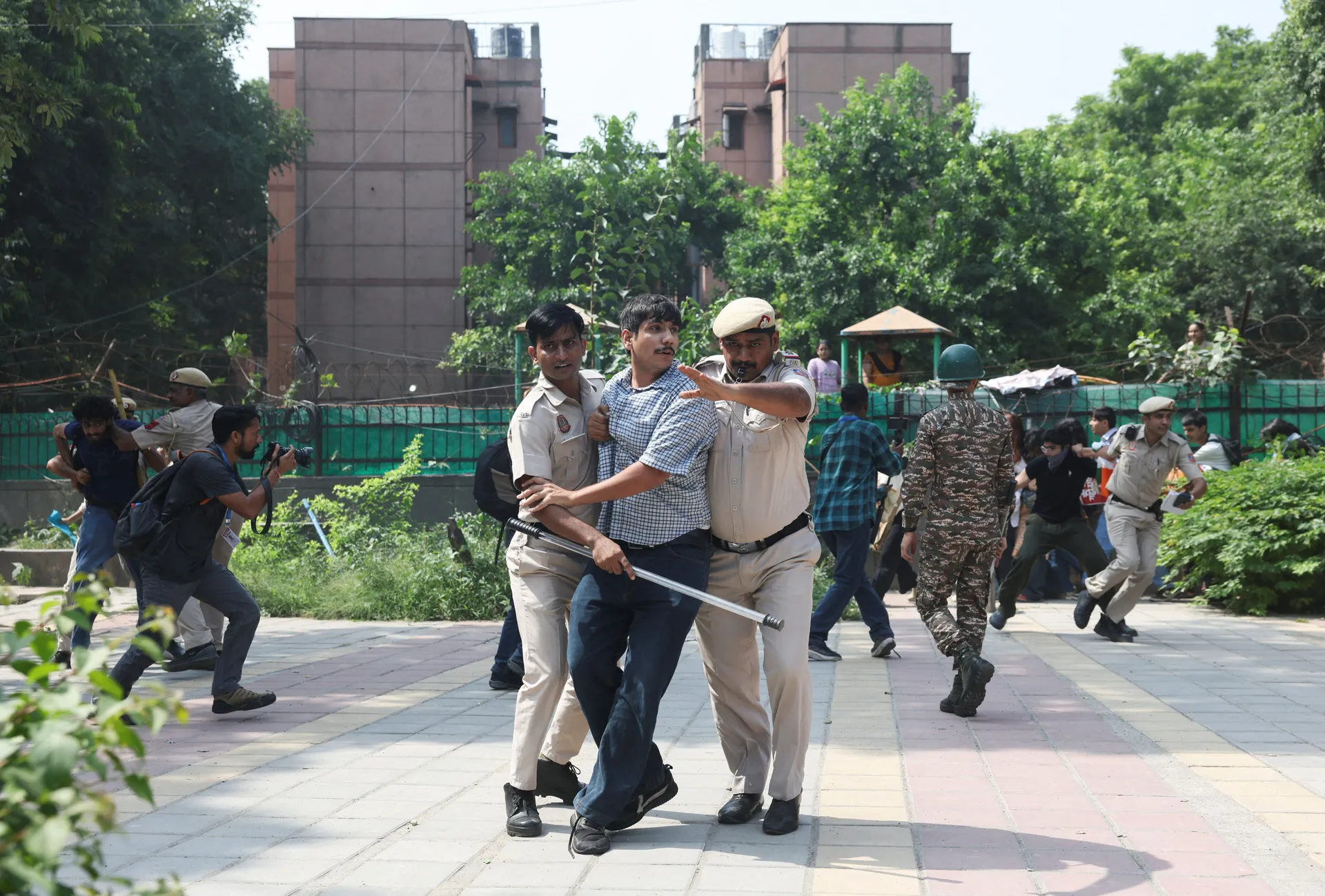 Protesters are detained by security personnel during a protest by the Cockroach Janta Party (CJP) seeking the resignation of India's Chief Election Commissioner Gyanesh Kumar, near the protest site in New Delhi, India, October 10, 2026. REUTERS/Bhawika Ch