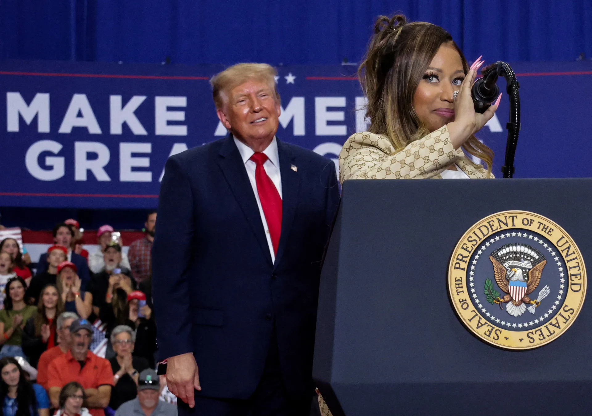 Recording artist Nicki Minaj and US President Donald Trump attend a rally, in support of Republican US Senate candidate, former US Representative Mike Rogers, ahead of the midterm elections, at an entertainment complex in Port Huron, Michigan, US, October